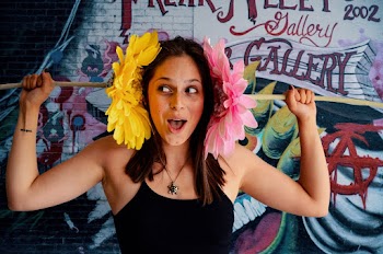 Unknown Person Holding Pink and Yellow Flowers