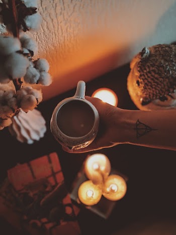 Unknown Person Holding White Mug