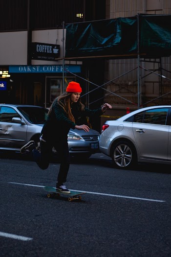 Unknown Person Riding on Skateboard Outdoors
