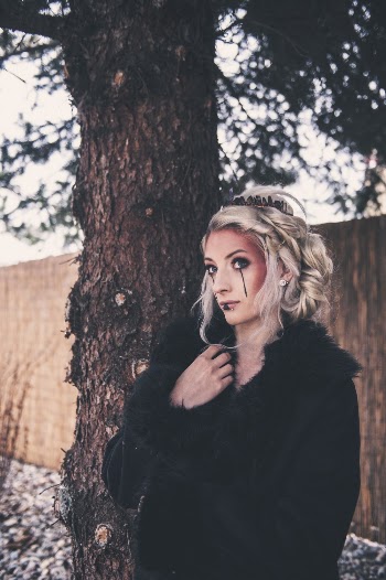 Unknown Person Standing Near Brown Tree