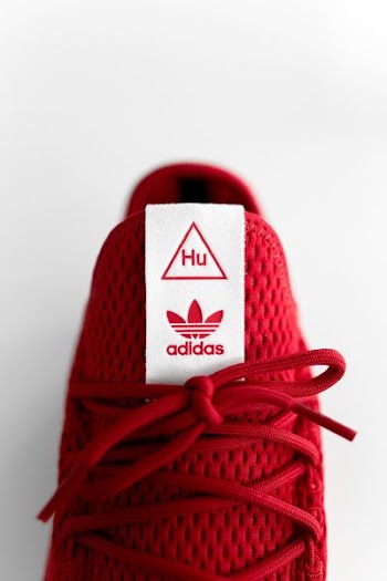 unpaired red adidas sneaker