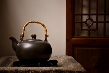 Unused Teapot on Side Table
