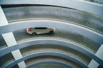 Up-down of the parking lot, Driving down the curved path, Way up - into the building's parking lot with a curved section.