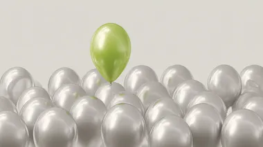 Uplifting Green Balloon Among Silver Balloons Uplifting Green Balloon Among Silver Balloons