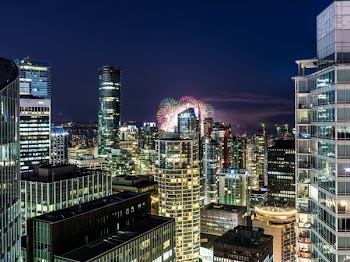 Urban City With Fireworks During Nighttime
