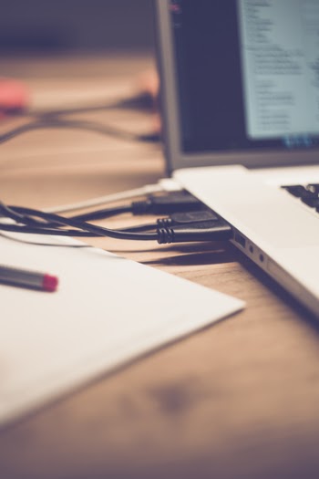 Usb Cable Plugged in on White and Black Computer Laptop