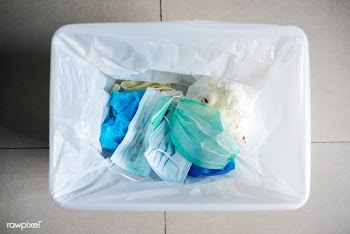 Used face masks in a contaminated waste bin | Free  photo - 2293297