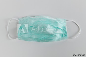 Used medical face mask during coronavirus pandemic