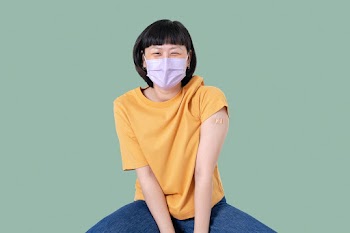 Vaccinated Asian woman presenting shoulder | Free stock photo | High Resolution image