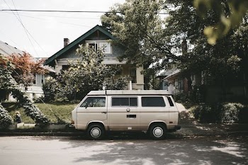 van in front house