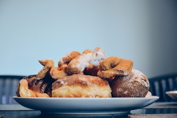 Varieties of Bread on White Ceramic Round Plate