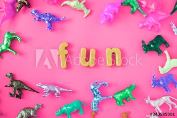 Various animal toy figures background with the word fun