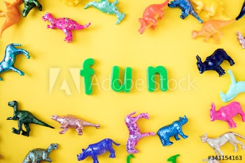 Various animal toy figures background with the word fun