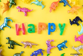 Various animal toy figures background with the word happy