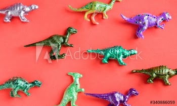 Various animal toy figures in a colorful background