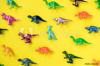 Various animal toy figures in a colorful background