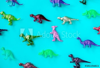 Various animal toy figures in a colorful background