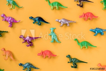 Various animal toy figures in a colorful background