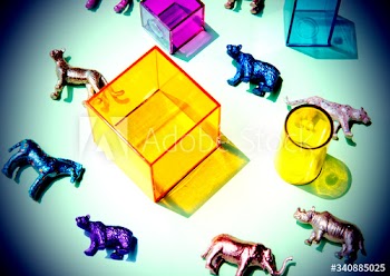 Various animal toy figures with boxes and in a colorful background