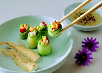 Vegetable Covered With Food Wrapper on Green Bowl With Chopstick Beside Purple Flower