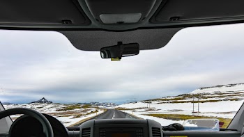 Vehicle in Between Snow Covered Field