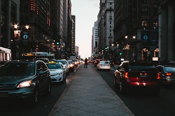 vehicles near building during daytime