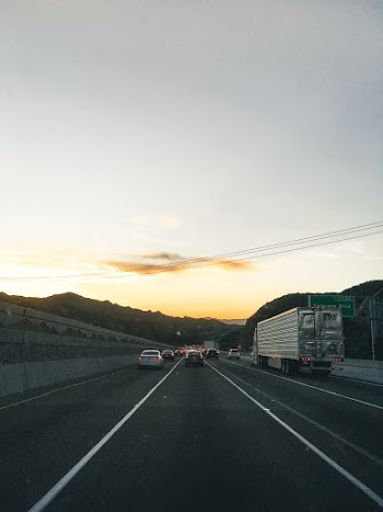 Vehicles on Road During Golden Hour