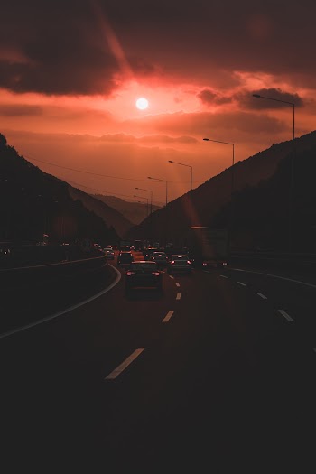 Vehicles  On The  Highway During Golden Hour