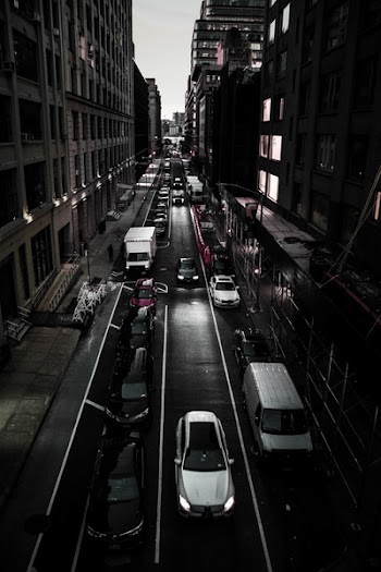 Vehicles Passing Between Concrete Structures