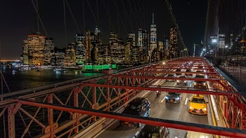 Vehicles Passing by a Bridge during Nighttime