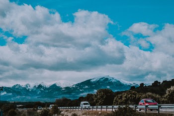 Vehicles Passing By Mountain
