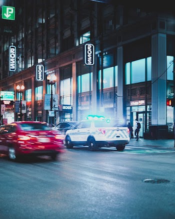Vehicles Passing Through Ross Building
