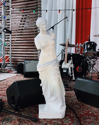 Venus De Milo Statue Beside Musical Instruments
