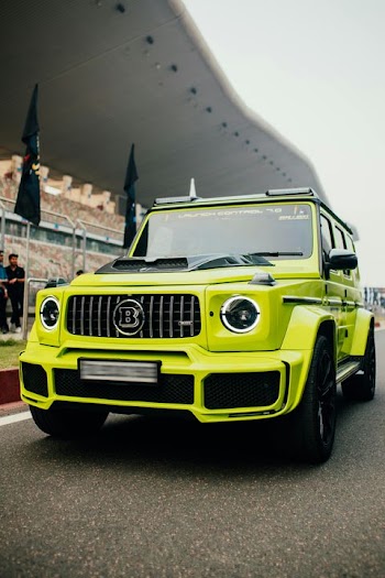 Vibrant Green Mercedes-Benz G-Class SUV at Race Track
