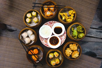Vibrant shot of feasting on chinese steamed and fried dim sum 