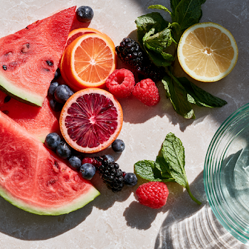 Vibrant Summer Fruit Arrangement on Kitchen Surface