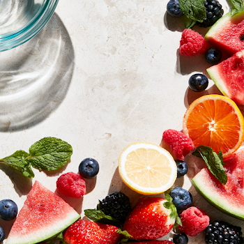 Vibrant Summer Fruit Arrangement on Stone Surface