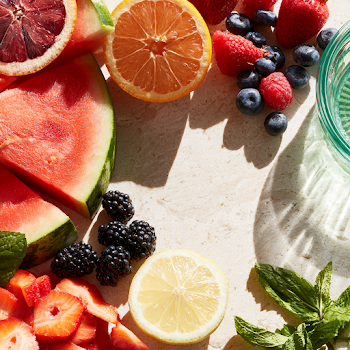 Vibrant Summer Fruits on Neutral Surface