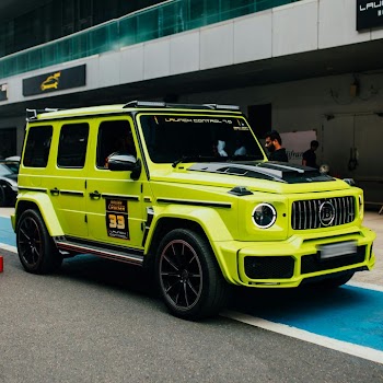 Vibrant Yellow Mercedes-Benz G-Class SUV in Urban Environment