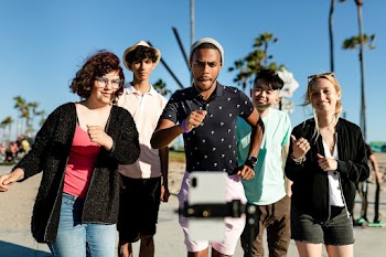 Video content creator dancing with friends in… | Free stock photo | High Resolution image