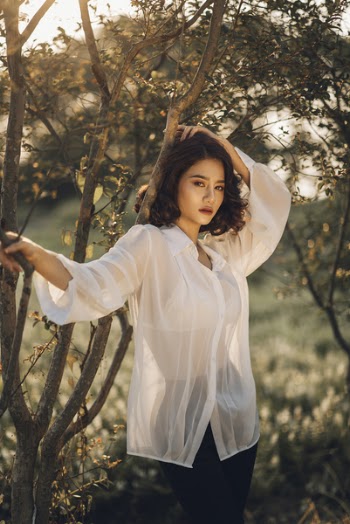 Vietnamese girl in a white & thin shirt