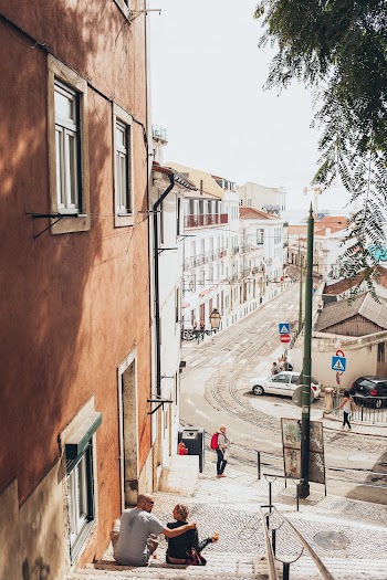 View Of A Town With People Outside