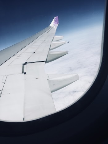 View of Airplane Wings from Inside a Plane