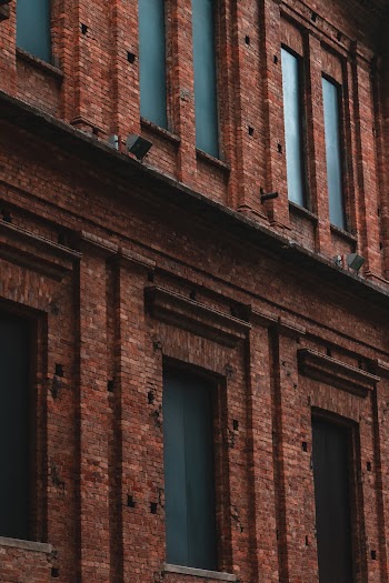 View of Brown Brick Buildings With Glass Windows