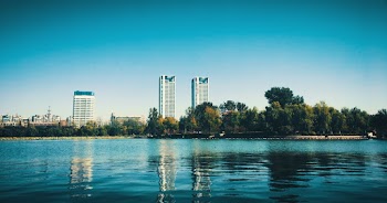 View Of Lake With Buildings On Background