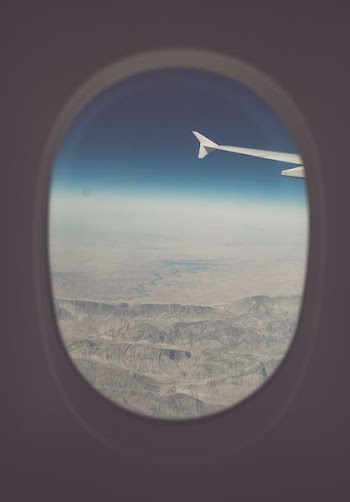 view of mountains from airplane window