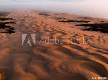 View of pattern on sand dune during sunset