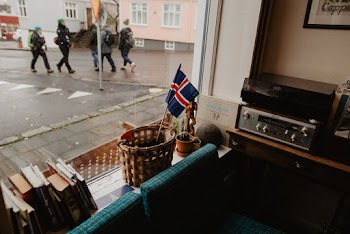 View Of People Walking on Street From A Glass Window