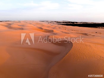 View of sand dunes during sunset