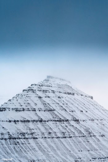 View of snowy Hv&iacute;thamar mountain in the Faroe Islands on a mist.. | Free  photo - 2329843